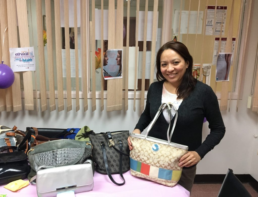 Patient with donated pocket book at cervical health event