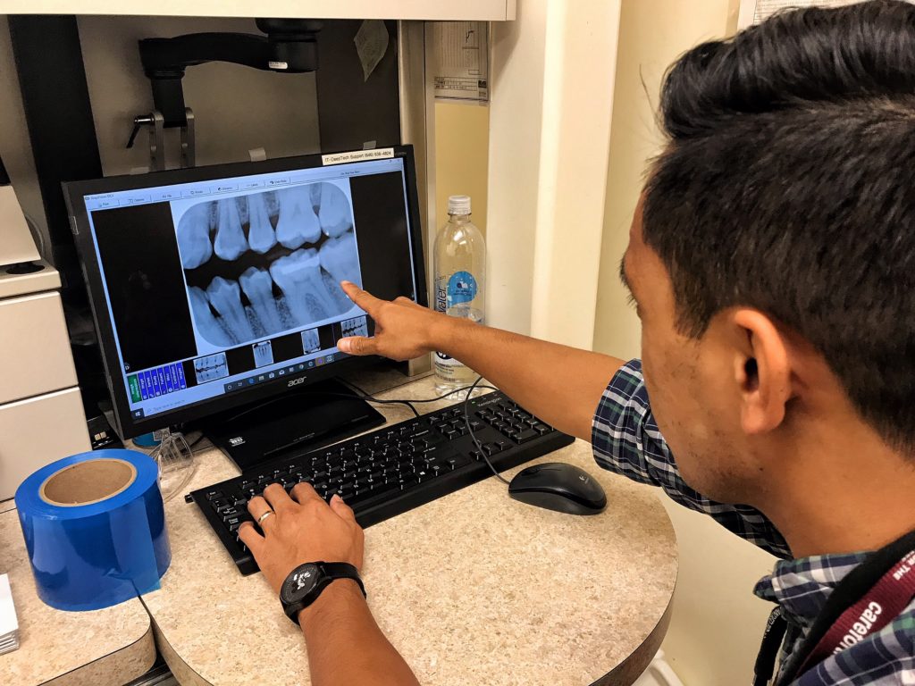 Dr. Makiling examining x-rays