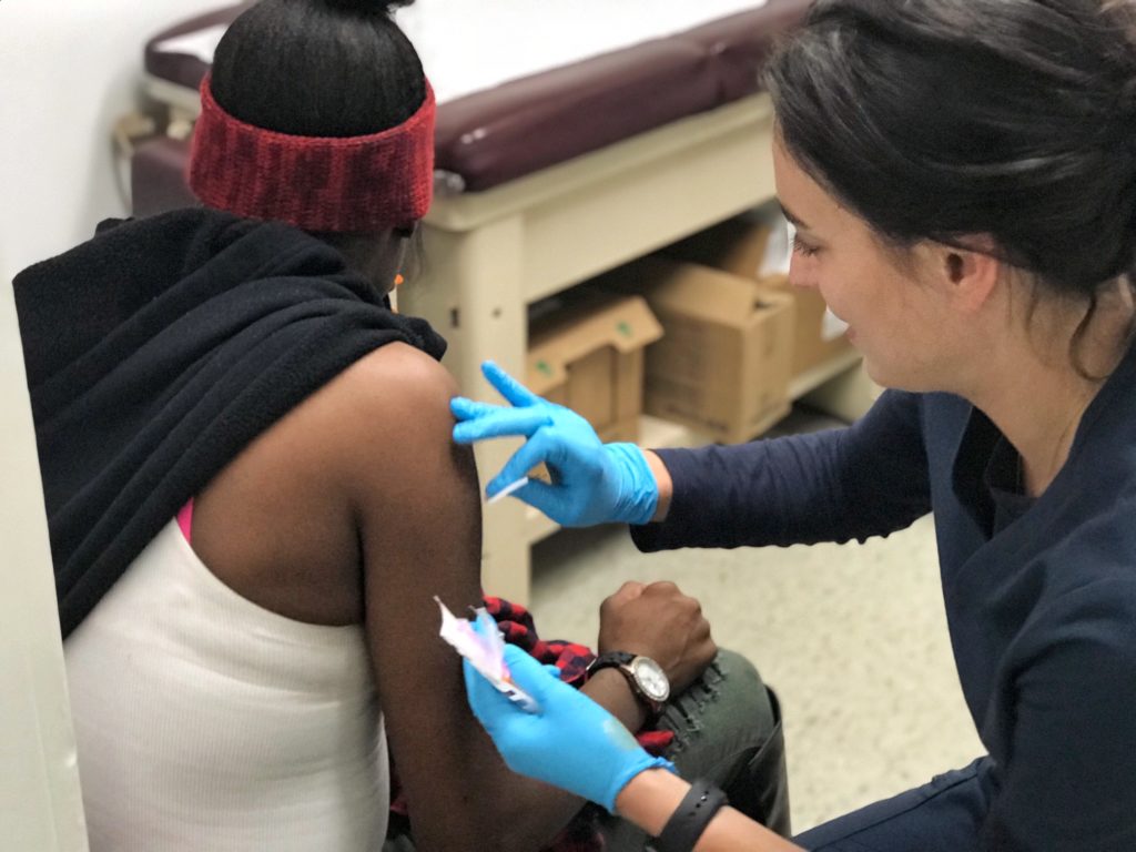 Patient Receiving a Flu shot at the Bushwick health center in Brooklyn