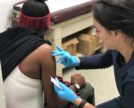 Patient Receiving a Flu shot at the Bushwick health center in Brooklyn